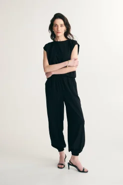 Fluid pants with fitted ankles