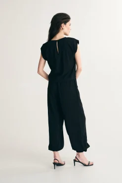 Fluid pants with fitted ankles
