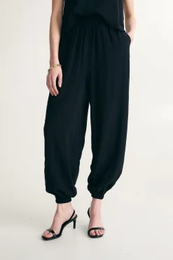 Fluid pants with fitted ankles