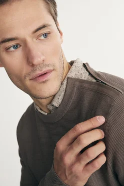 Sweater with shoulder zipper